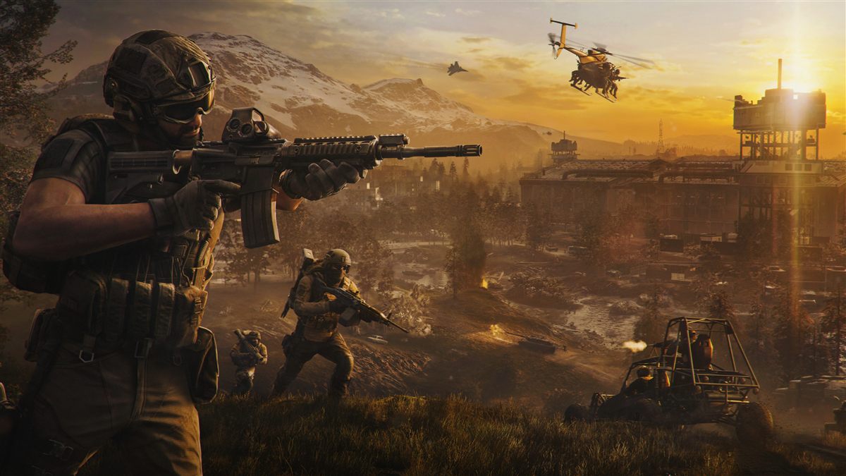 Soldiers, a helicopter and a buggy in a mountainous battlefield at sunset
